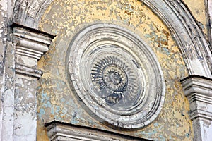 Fragment of wall of church building Ã¢â¬â beautiful old gypsum plaster rosace in classical style on the wall